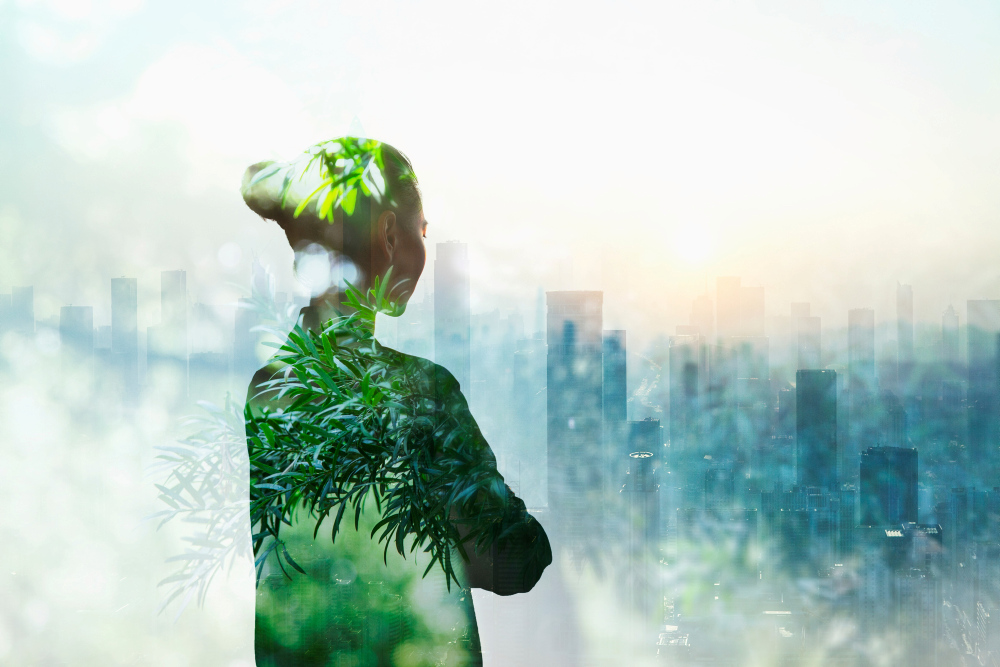 Vrouwelijk silhouet in groen kijkt naar stedelijke omgeving - concept one health planetary health wat catastrophic collaps moet tegengaan